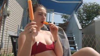 Cutie Having Fun In The Sun. Tanning, Lotion and Popsicles